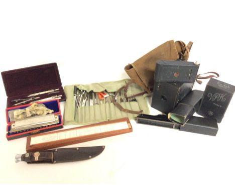 A collection of oddments including a Horner harmonica, Surgeons field set, boxed Model B Kodak camera