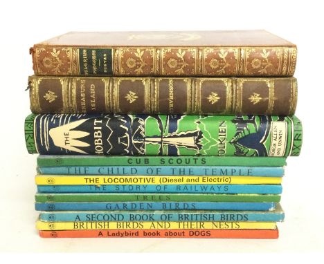 A collection of vintage books including Lady Bird books , The Hobbit, Treasure Island 1913 and a full leather The Pilgrims Pr