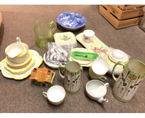 A collection of ceramics including a ABJ Grafton tea service, Tudor ware jugs, Beswick houses etc