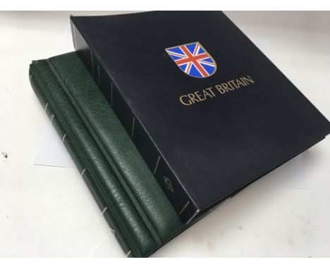 2 albums of Great Britain postage stamps ,the first containing mint / used stamps from Queen Victoria to 1984, the other with