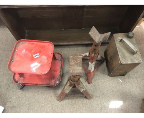 A group of car mechanic tools including a dolly, axle props and a fuel canister. NO RESERVE