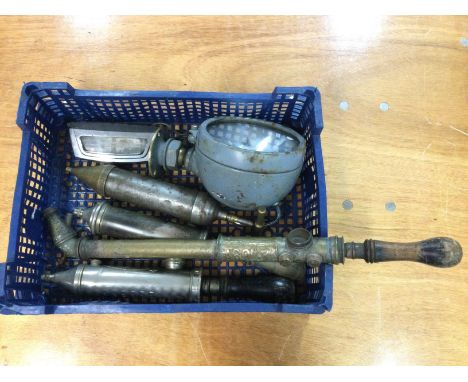 Vintage various metal pumps and a small searchlamp. Postage cat D