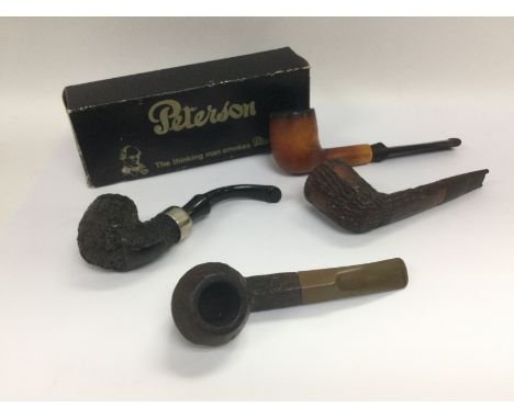 Four vintage pipes comprising a Peterson example, Meerschaum billiard pipe and two others. Shipping category B.