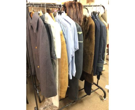 A collection of RAF WW2 uniforms including vintage 1940s ladies dresses and other outfits