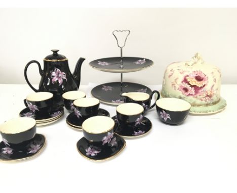 A mid 20th century design British ceramic coffee set Orchid pattern with a cake stand and a Victorian cheese dish and cover (