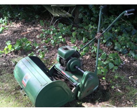 A Ransomes Marquis power assisted roller wide blade petrol engine lawn mower.