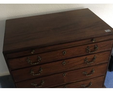An 18th Century George III mahogany caddy shaped chest of drawers with a brushing slide above four graduating drawers. on bra