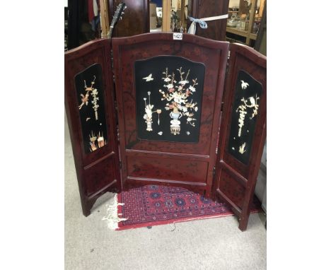 A Quality Japanese lacquer folding fire screen decorated with raised mother of pearl Hight 92cm