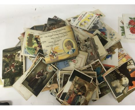 A large collection of antique and Vintage postcards including comical Bamforth cards some I world war silk embroidered cards 