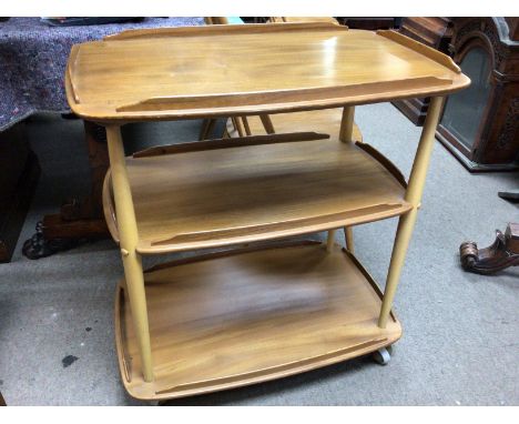 A Ercol three tier tea trolley.