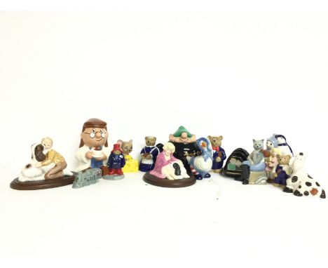 A collection of Wade ceramic figures including Pantomime horse, Baby bear, Mother goose, Welcome home Paddington, Tetley etc.