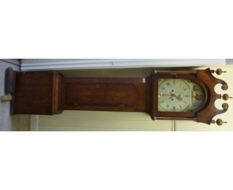 An early 19thC country made, honey coloured oak longcase clock, the hood having a swan neck pediment, over an arched, glazed,