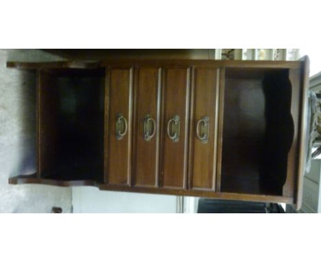 An Edwardian mahogany sheet music cabinet, having an open shelf, over four drawers, raised on splayed, bracket feet  38''h  1