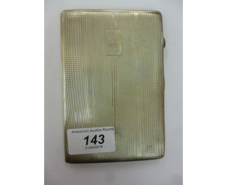 A silver folding cigarette case with engine turned decoration, on a button clasp  Birmingham 1946         11