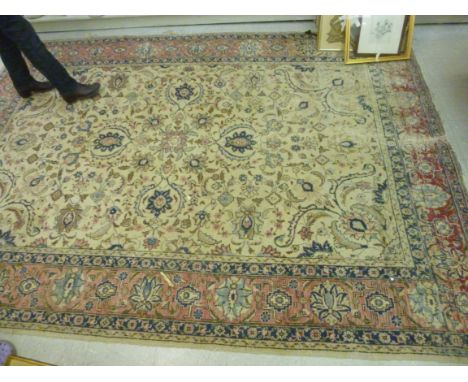 A North West Persian carpet with palmettes, flowers and foliage on a beige ground  123'' x 92''         S