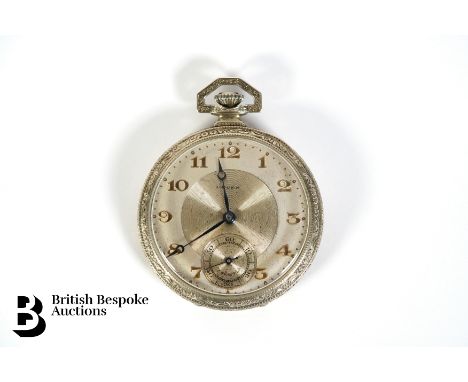 A Gruen 18k gold plated open faced pocket watch. The watch having a 45mm case with silvered engine-turned face with gold colo