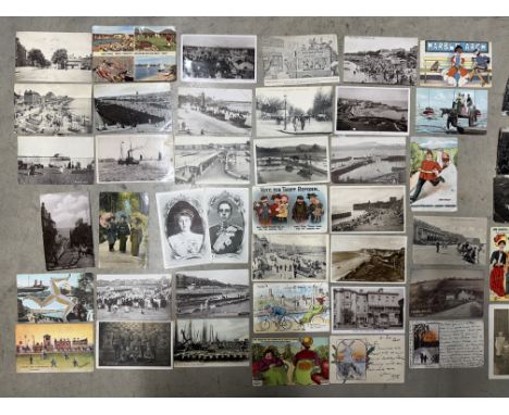This lot comprises over 800 vintage or antique postcards, two old albums and loose as follows: a brown postcard album contain