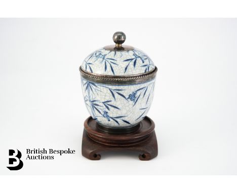A crackle glazed blue and white ceramic pot and cover, with silver rim and finial, stamped sterling 929, approx 12 cms h toge