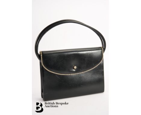 A vintage Asprey handbag, black leather, circa 1960s, with twin handles, with a zip-effect border, push button lock, approx 2