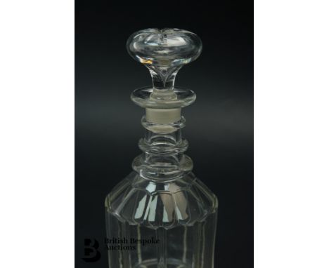 A Georgian crystal cylindrical glass decanter and stopper with neck rings and faceted body together with a pair of Bristol bl