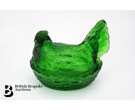 Vintage emerald green glass egg basket in the shape of a hen, approx 19 cms l x 17 h cms.&nbsp;