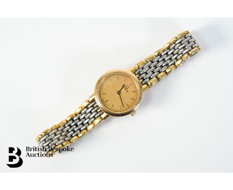 A lady's gold and stainless steel Omega quartz wrist watch, 20mm case with a gold engine-turned face with baton markers,1459 