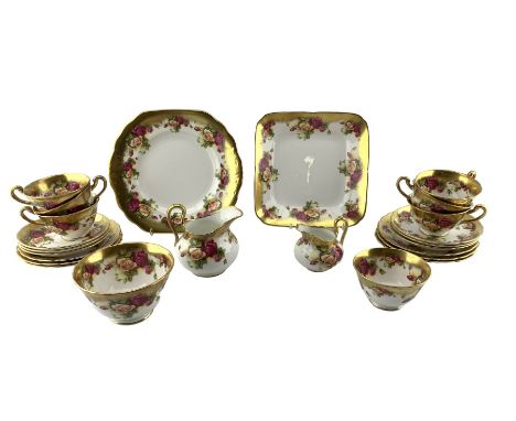 Royal Chelsea Golden Rose pattern tea set for six comprising six teacups, saucers and tea plates, two sugar bowls, two milk j