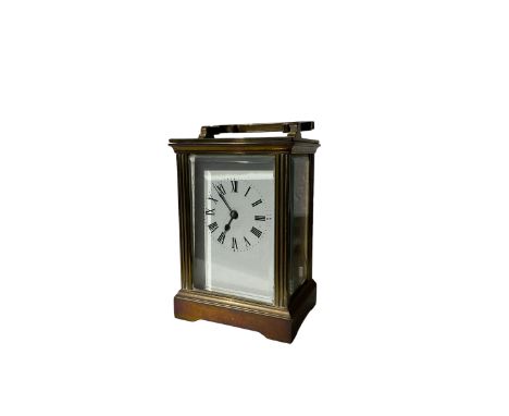 Early 20th century 8-day French carriage clock - with an anglaise case carrying handle and bevelled glass panels, white ename