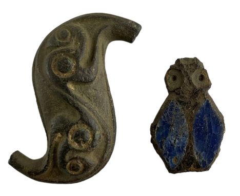 Roman British or Iron age copper alloy Dragonesque brooch, the concave s-shaped plate decorated with intricate curved and spi