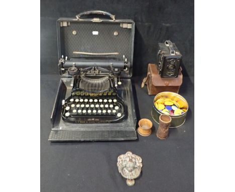 A CORONA SPECIAL PORTABLE TYPEWRITER, CASED together with a Box Brownie camera, a cast metal lion door knocker, two dice tumb