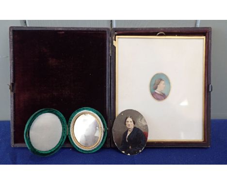 MINIATURE WATERCOLOUR PORTRAIT IN A LEATHER CASE dated 1862, with a small oval cased Daguerrotype photo and a tinted photogra