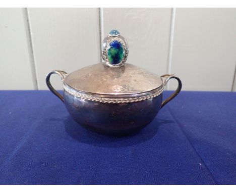 AN ARTS AND CRAFTS SILVER ON COPPER BOWL AND COVER with enamel and jewelled finial, hand hammered finish, 10 cms high