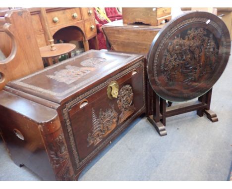 A CHINESE CAMPHORWOOD CARVED TRUNK and a similar folding table