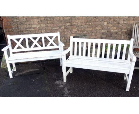 A GARDEN BENCH BY ALEXANDER ROSE 123cm wide, and another similar bench, both painted white (both weathered, with some soft ar