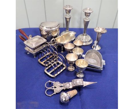 A COLLECTION OF SILVER PLATE including a tea caddy, candlesticks, tea set, toast racks etc