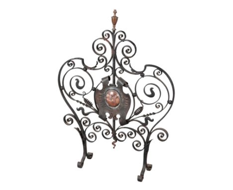 AN ARTS AND CRAFTS STYLE WROUGHT-IRON FIRESCREEN 20th century, in the manner of the Bromsgrove Guild, 86cm high x 64cm wide