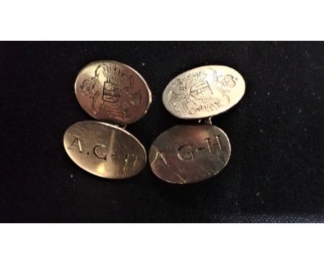 A PAIR OF GOLD COLOURED METAL CUFFLINKS engraved with armorial and initials, combined weight 11 grams (thought 9ct gold)
