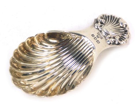 An Elizabeth II silver shell caddy spoon, maker AC &amp; S limited, London 1974, 0.7oz.