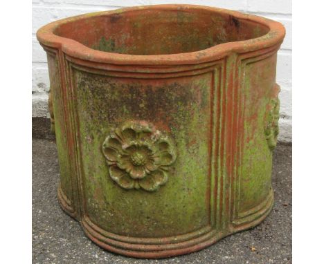 A terracotta planter, with Yorkshire Rose on four panelled design, 35cm high, 42cm wide.