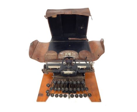 A Blickensderfer American number 5 typewriter, supplied by Taylor's Ltd, in leather case, name plate for C Wilkinson, 33cm wi