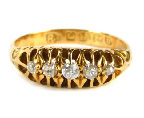 An 18ct gold diamond gypsy ring, old cut diamonds each in claw setting, with scroll design shoulders, size F, 2.7g all in.