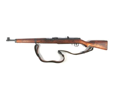 An Anschutz Hakim German made Egyptian army air rifle, with Arabic writing, skull on wooden stock, with leather carry handle,
