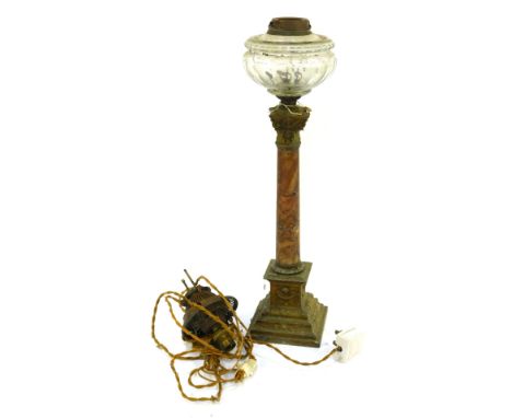 A 19thC onyx and brass columned oil lamp, on a stepped floral moulded base, 57cm high.WARNING! This lot contains untested or 