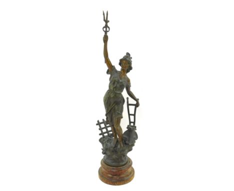 A late 19th/early 20thC spelter figure group, of a lady with trident, on rocked base, 72cm high. 