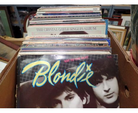 Box of vinyl LP records to include Rock and Pop with various artist Blondie, ABBA, Bob Dylan etc. Not available for in-house 