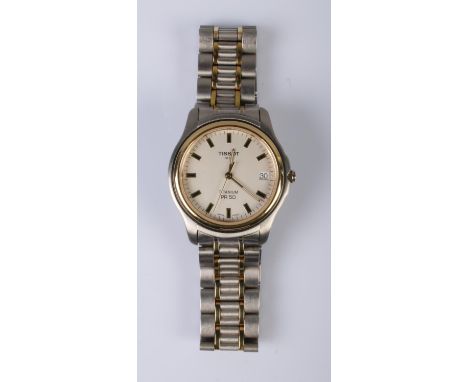 A boxed gents Tissot Titanium PR50 wristwatch with date display and baton markers. Includes original guarantee and two spare 