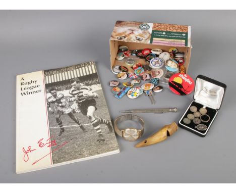 A quantity of collectables to include vintage, mostly music themed pin badges, John Etty signed book: A Rugby League Winner, 