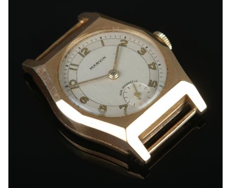 A 9ct Gold cased Marvin Non-Magnetic ladies manual wind wristwatch head, featuring Arabic numeral markers and subsidiary seco
