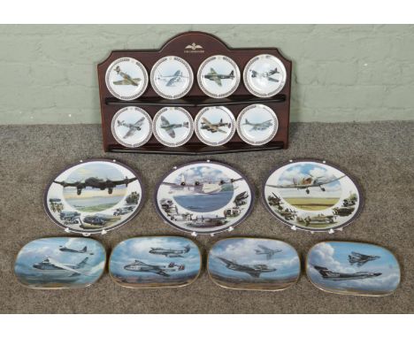 A quantity of aviation collectables including a small amount of cabinet plates, along with a wall mounted shelf with Davenpor