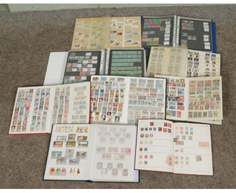 A box of albums containing a collection of world stamps to include the Commonwealth, French, German and British examples. Als